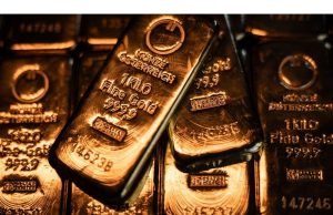Emas naik untuk mencatat sebagai masalah perang dagang mendorong permintaan surga